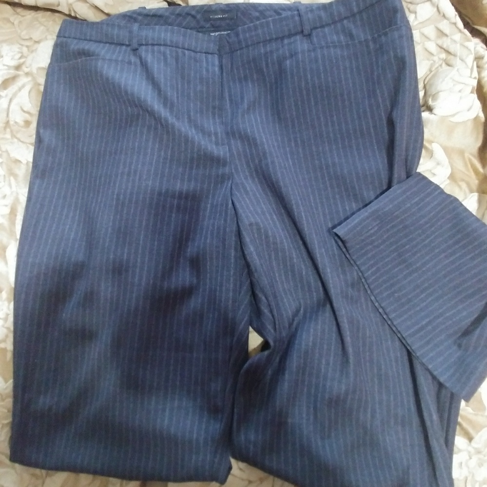 Grey and white pin striped slacks.